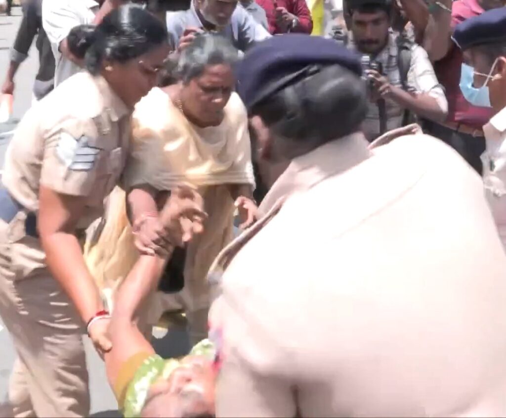 திமுக நிர்வாகி நில அபகரிப்பு: தலைமைச் செயலகம் எதிரே பெண் தீக்குளிக்க முயற்சி மற்றும் நடுரோட்டில் போராட்டம்